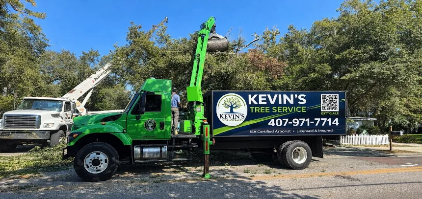 Kevin’s Tree Service grapple truck loading tree debris