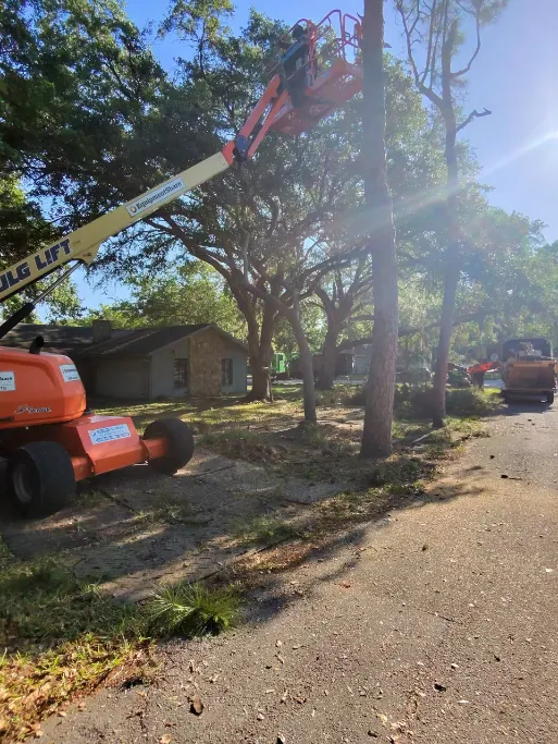 Aerial lift with turf tires working on a residential lot